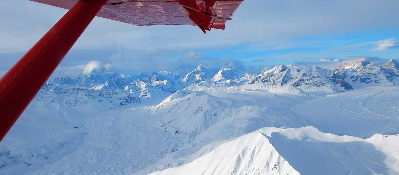 Alaska northern lights tour image of view from flight seeing over Alaska Range